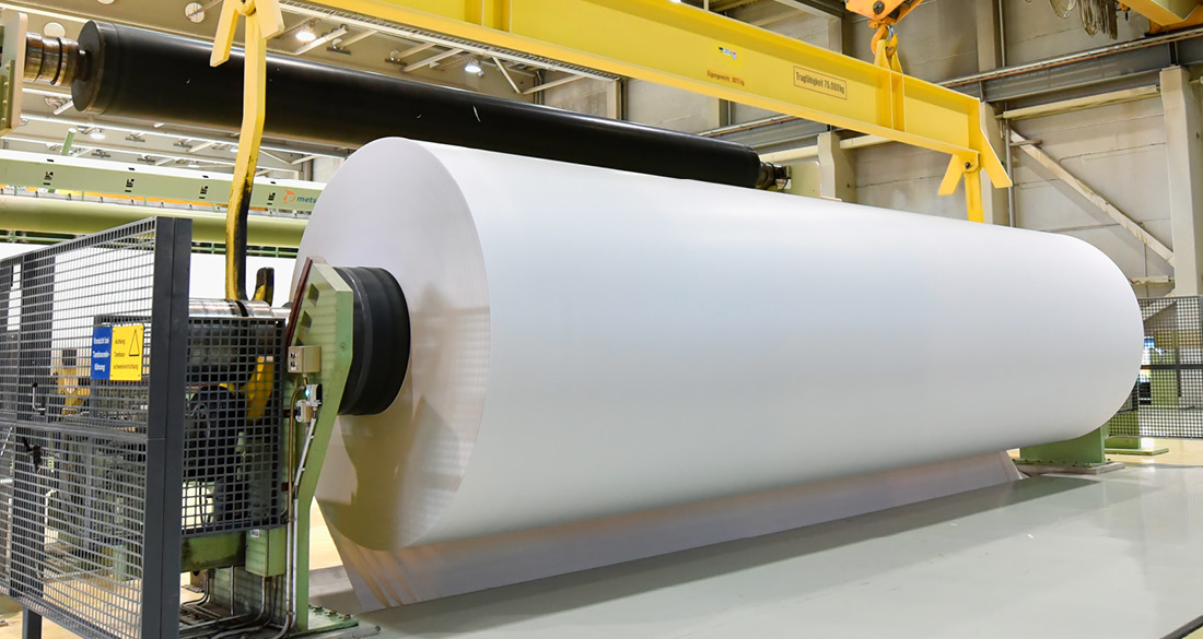 Large format paper roll in printer's warehouse